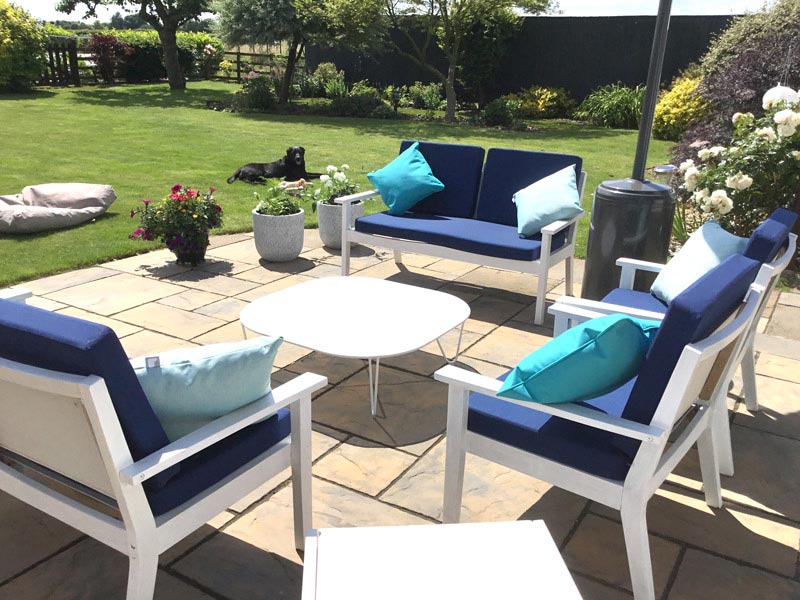 Bespoke outdoor cushions for an outdoor wooden chair and sofa set