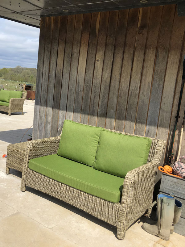 Replacement outdoor furniture cushions for a wicker 2-seater sofa