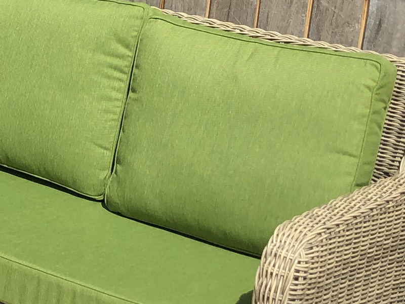 Recovered outdoor cushions for an exterior wicker furniture suite
